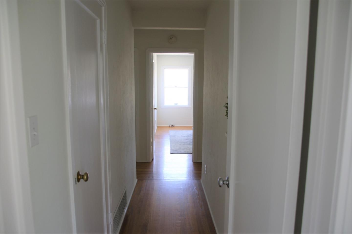 747 North 18th Street San Jose, CA 95112 - Photo 18 of 39 a view of a hallway with wooden floor