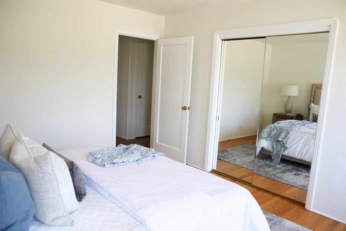 747 North 18th Street San Jose, CA 95112 - Photo 21 of 39 a bedroom with a bed and a mirror
