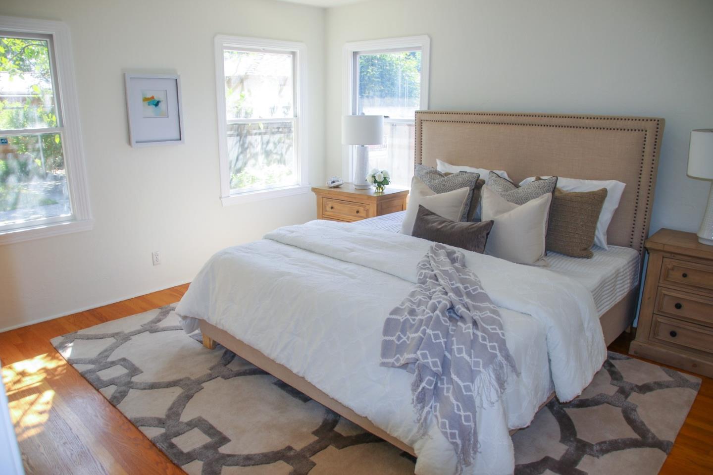 747 North 18th Street San Jose, CA 95112 - Photo 22 of 39 a bedroom with bed and window