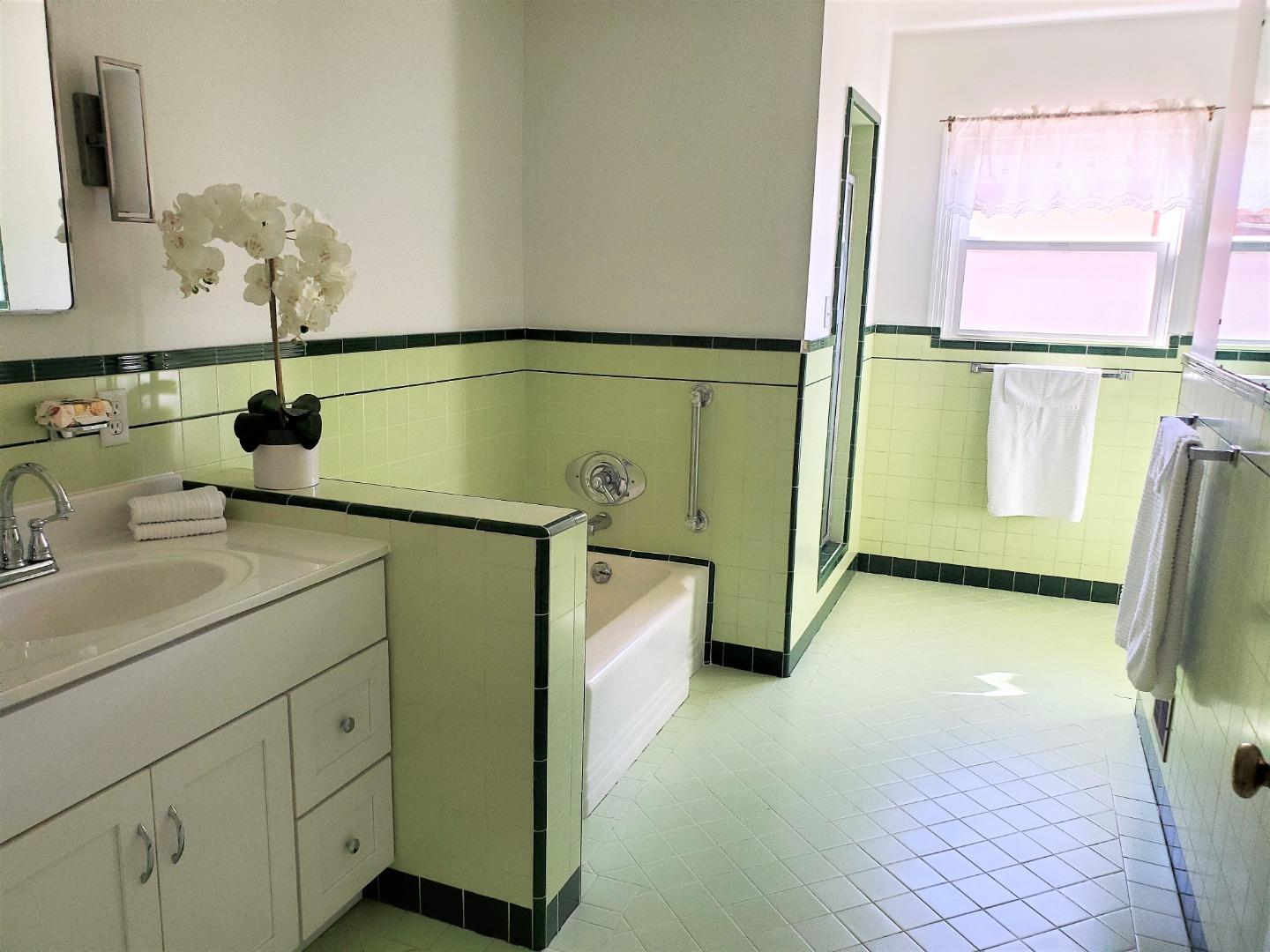 747 North 18th Street San Jose, CA 95112 - Photo 24 of 39 a bathroom with a sink and mirror
