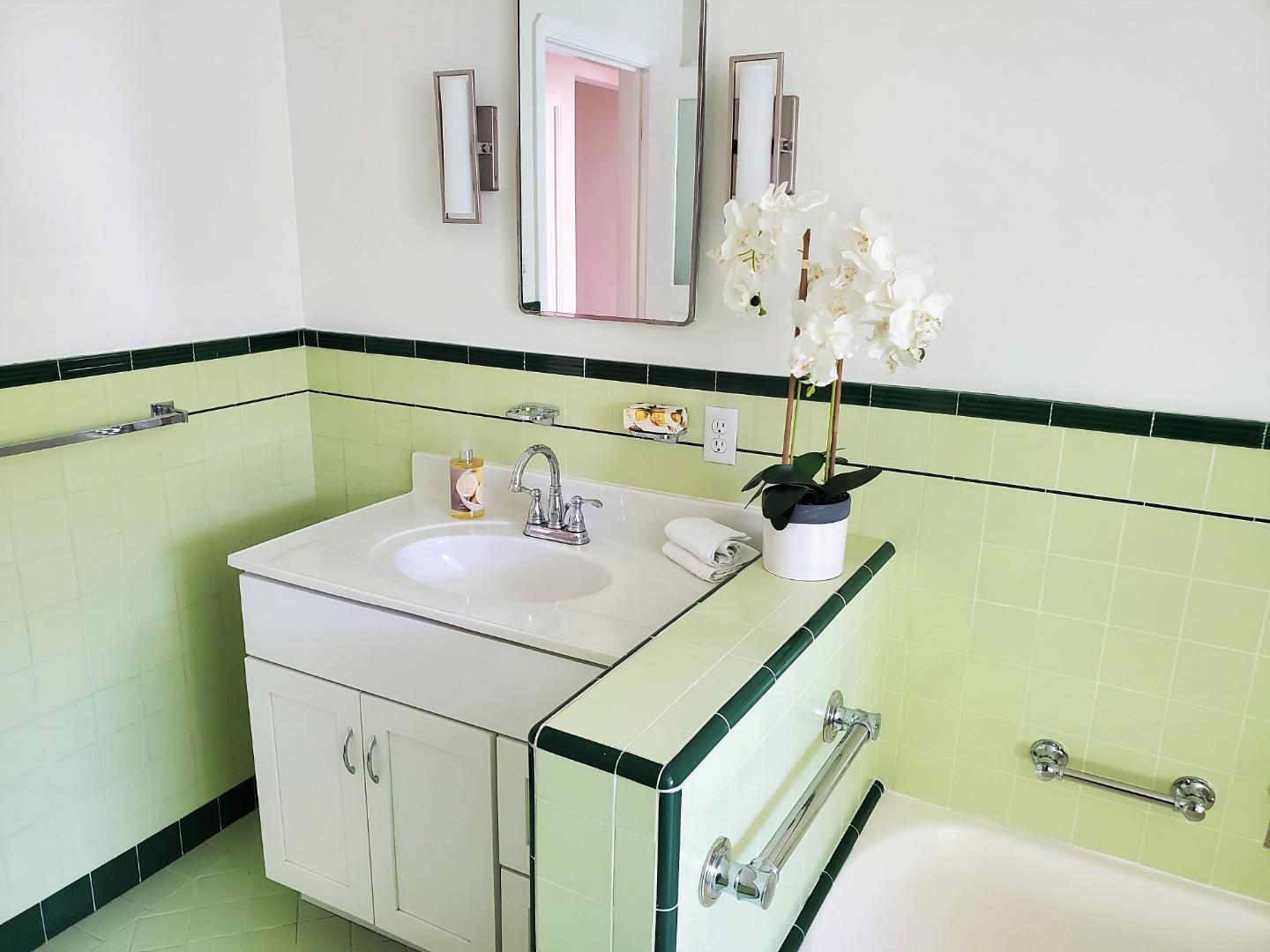 747 North 18th Street San Jose, CA 95112 - Photo 26 of 39 a bathroom with a sink and a mirror