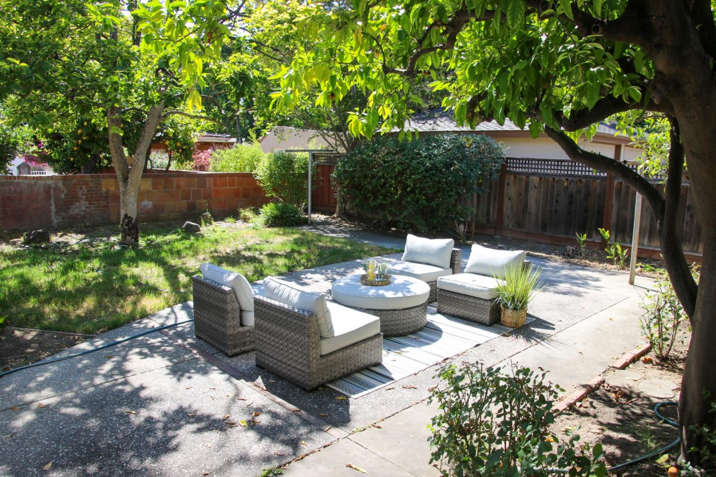 747 North 18th Street San Jose, CA 95112 - Photo 33 of 39 a view of a backyard with couches plants and wooden fence