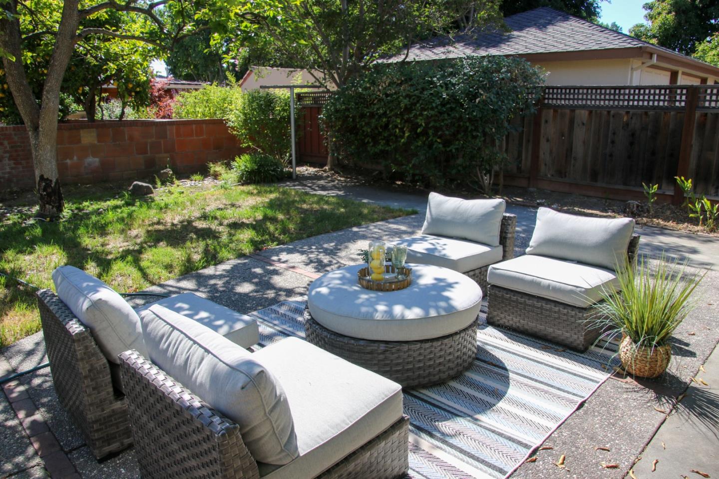 747 North 18th Street San Jose, CA 95112 - Photo 34 of 39 a view of a patio with couches table and chairs and potted plants