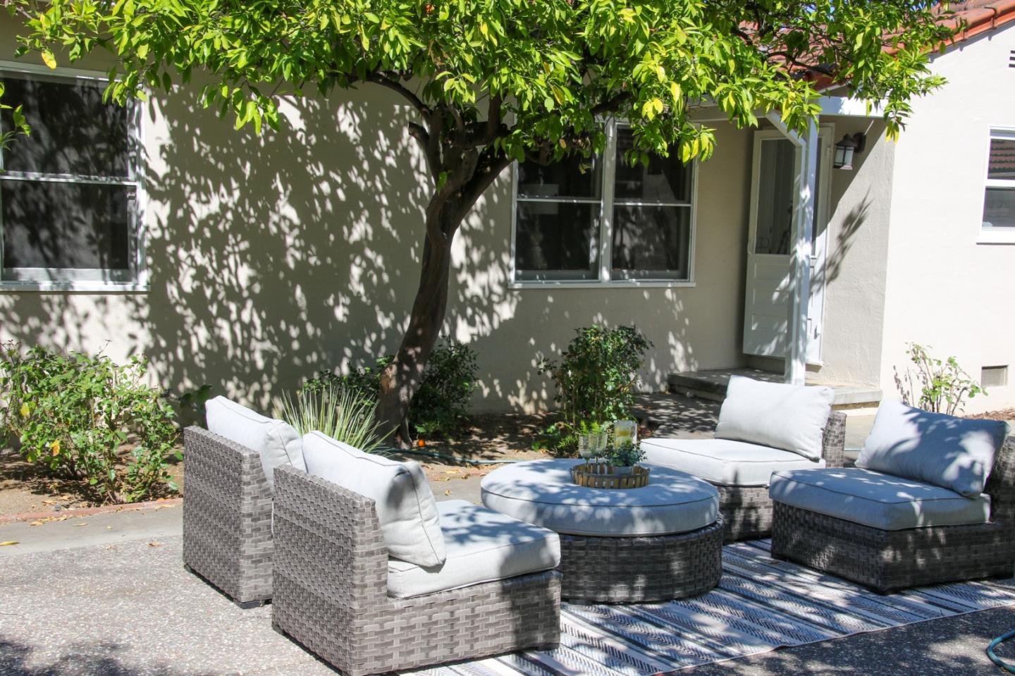 747 North 18th Street San Jose, CA 95112 - Photo 35 of 39 a view of a patio with couches table and chairs and potted plants