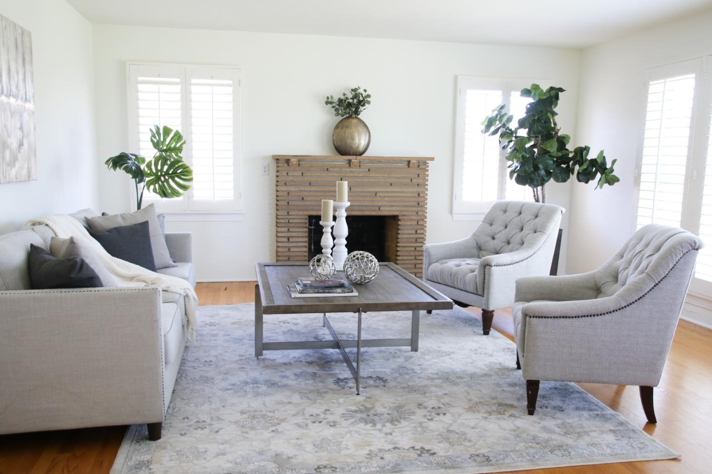 747 North 18th Street San Jose, CA 95112 - Photo 6 of 39 a living room with furniture a potted plant and a fireplace