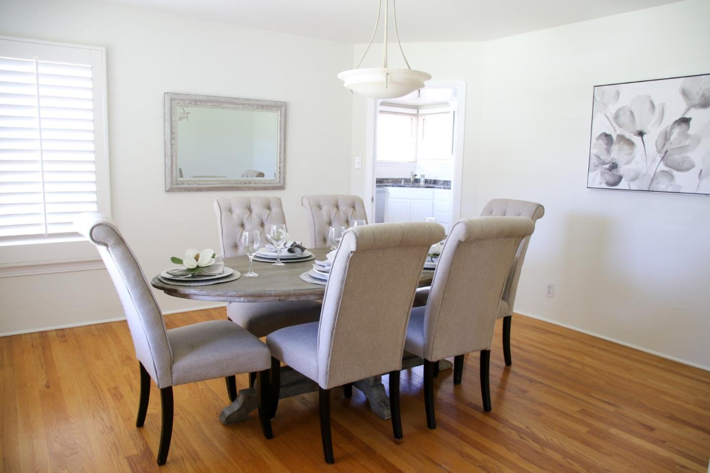 747 North 18th Street San Jose, CA 95112 - Photo 10 of 39 a view of a dining room with furniture window and wooden floor