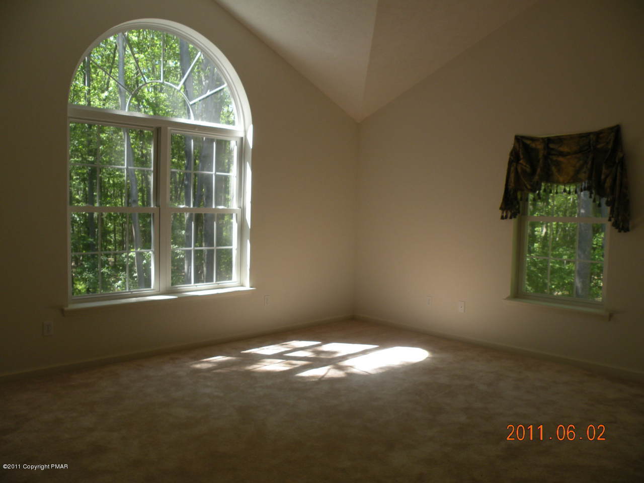 315 Red Run Road Pocono Summit, PA 18346 - Photo 6 of 10 an empty room with windows