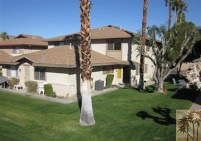 72644 Raven Road, Unit 3 Palm Desert, CA 92260 - Photo 1 of 11 a front view of a house with a garden and plants