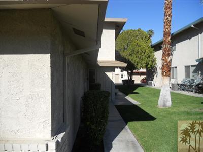 72644 Raven Road, Unit 3 Palm Desert, CA 92260 - Photo 2 of 11 a view of a house with a yard