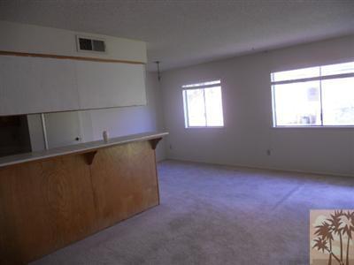 72644 Raven Road, Unit 3 Palm Desert, CA 92260 - Photo 4 of 11 an empty room with windows