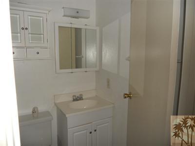 72644 Raven Road, Unit 3 Palm Desert, CA 92260 - Photo 10 of 11 a bathroom with a sink toilet and vanity