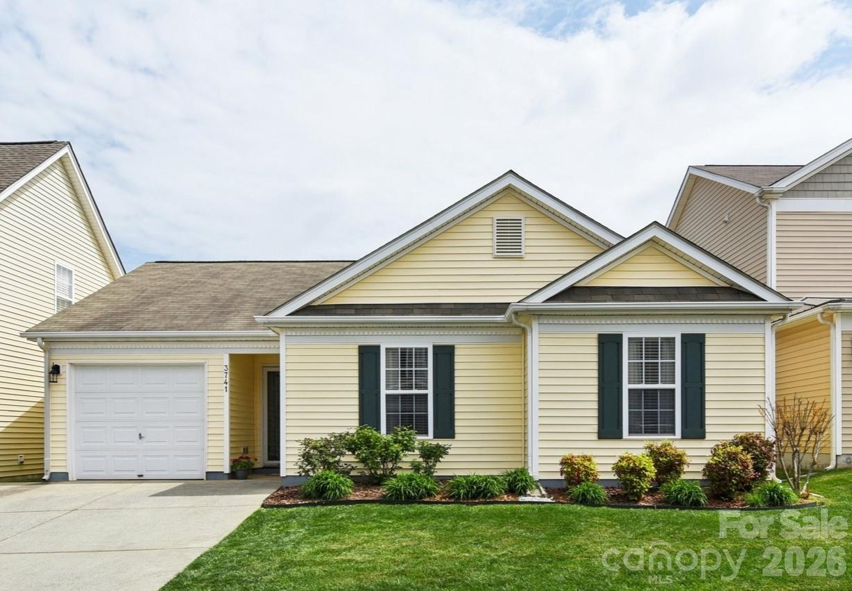 front view of a house and a yard