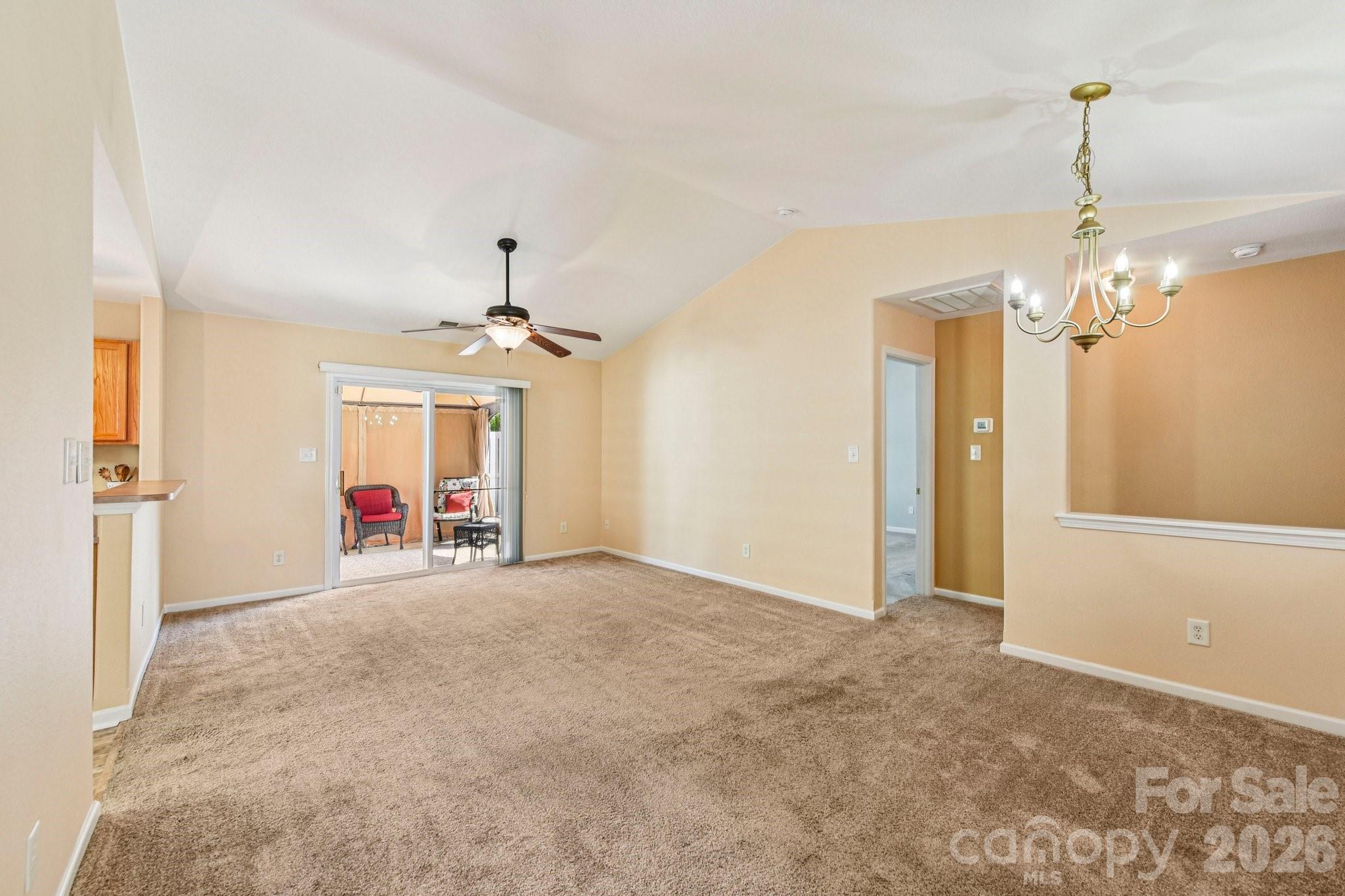 3741 Capris Lane Fort Mill, SC 29707 - Photo 3 of 22 a view of a livingroom with a chandelier and garage