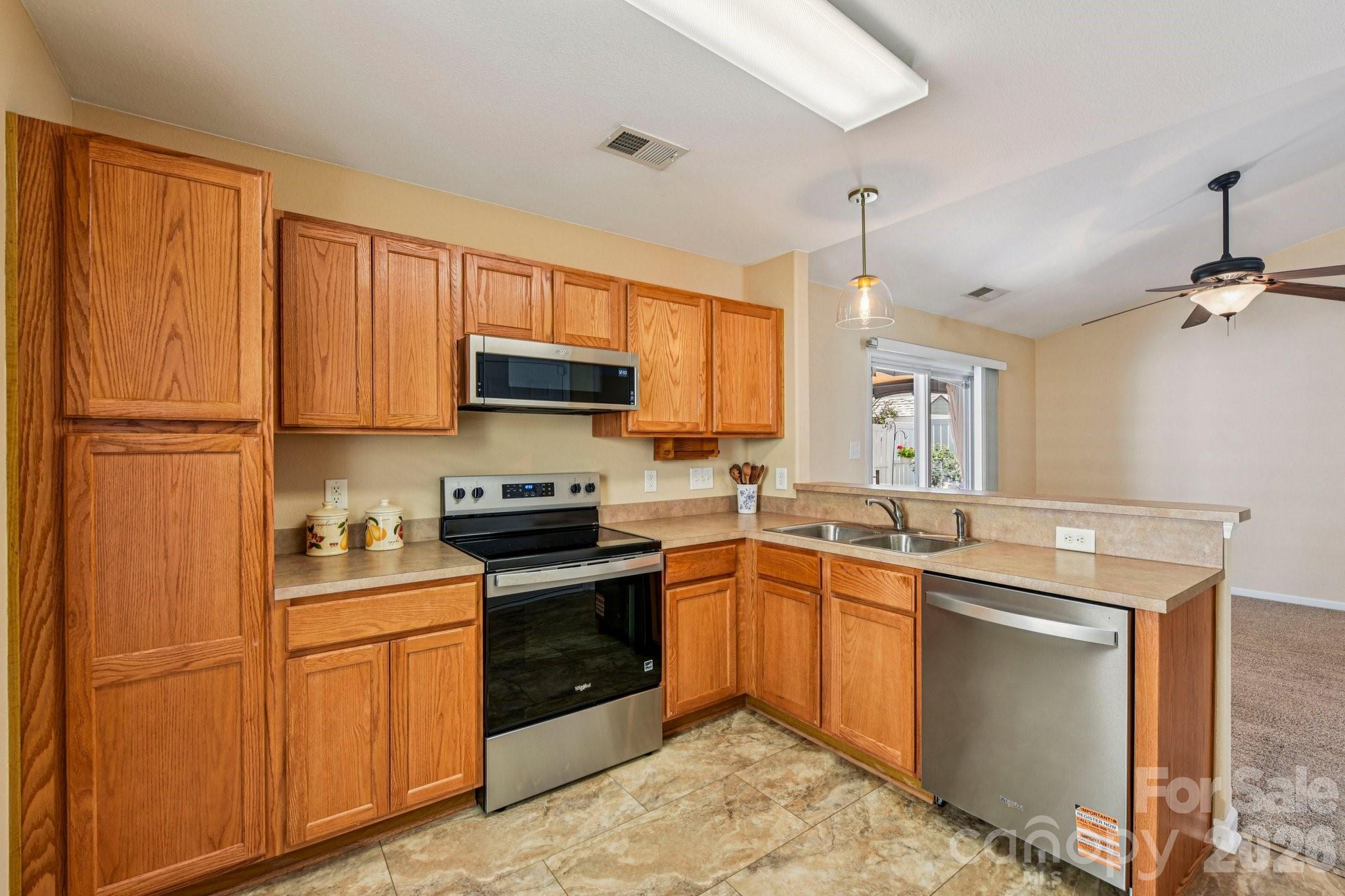 3741 Capris Lane Fort Mill, SC 29707 - Photo 5 of 22 a kitchen with a sink stove and microwave