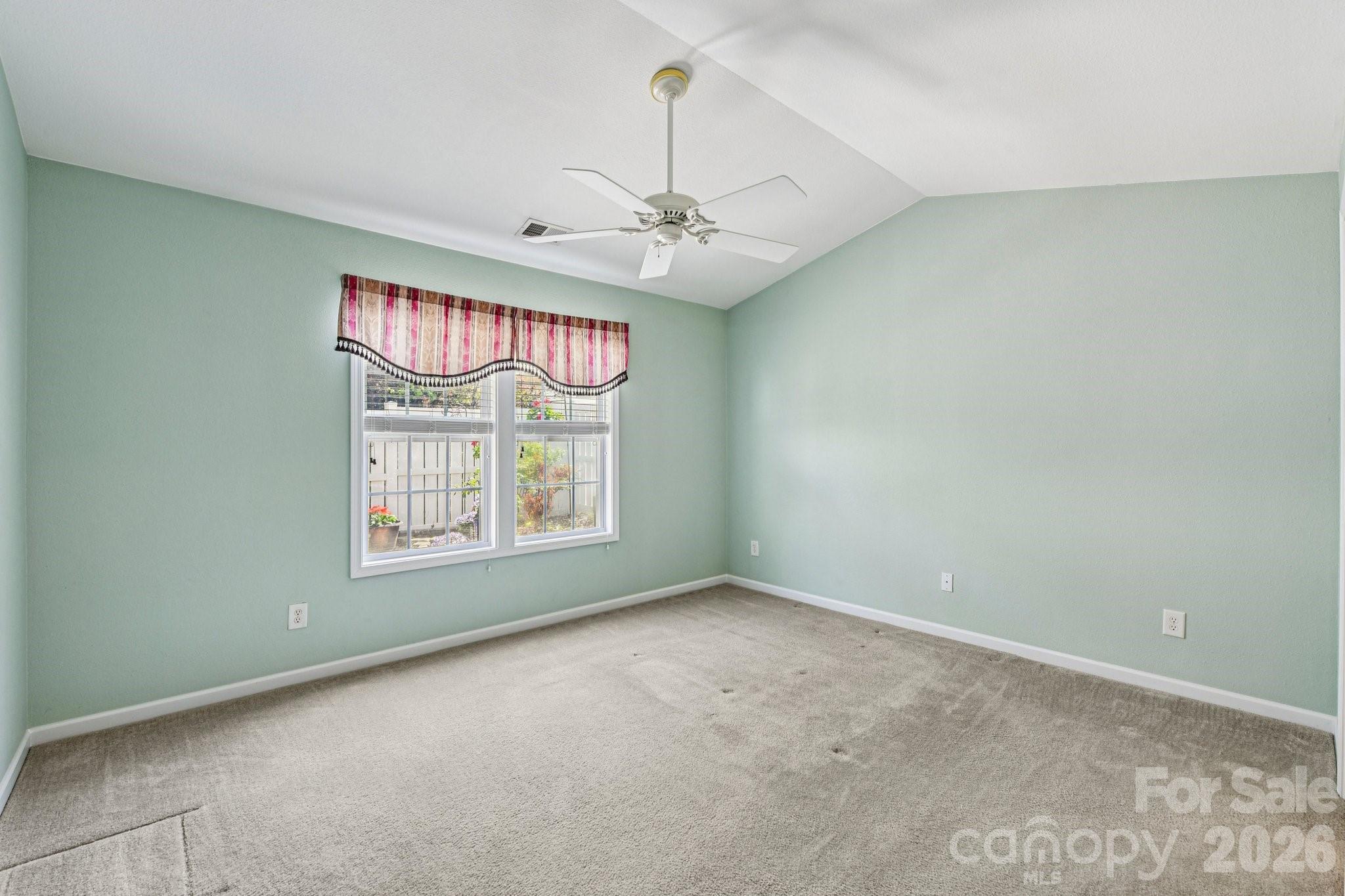 3741 Capris Lane Fort Mill, SC 29707 - Photo 8 of 22 an empty room with windows and ceiling fan