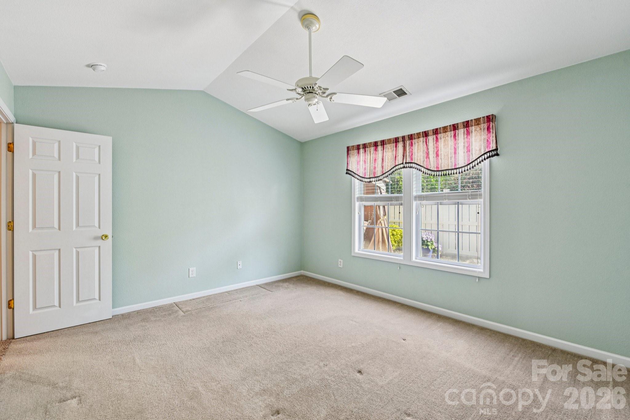3741 Capris Lane Fort Mill, SC 29707 - Photo 9 of 22 an empty room with windows and fan