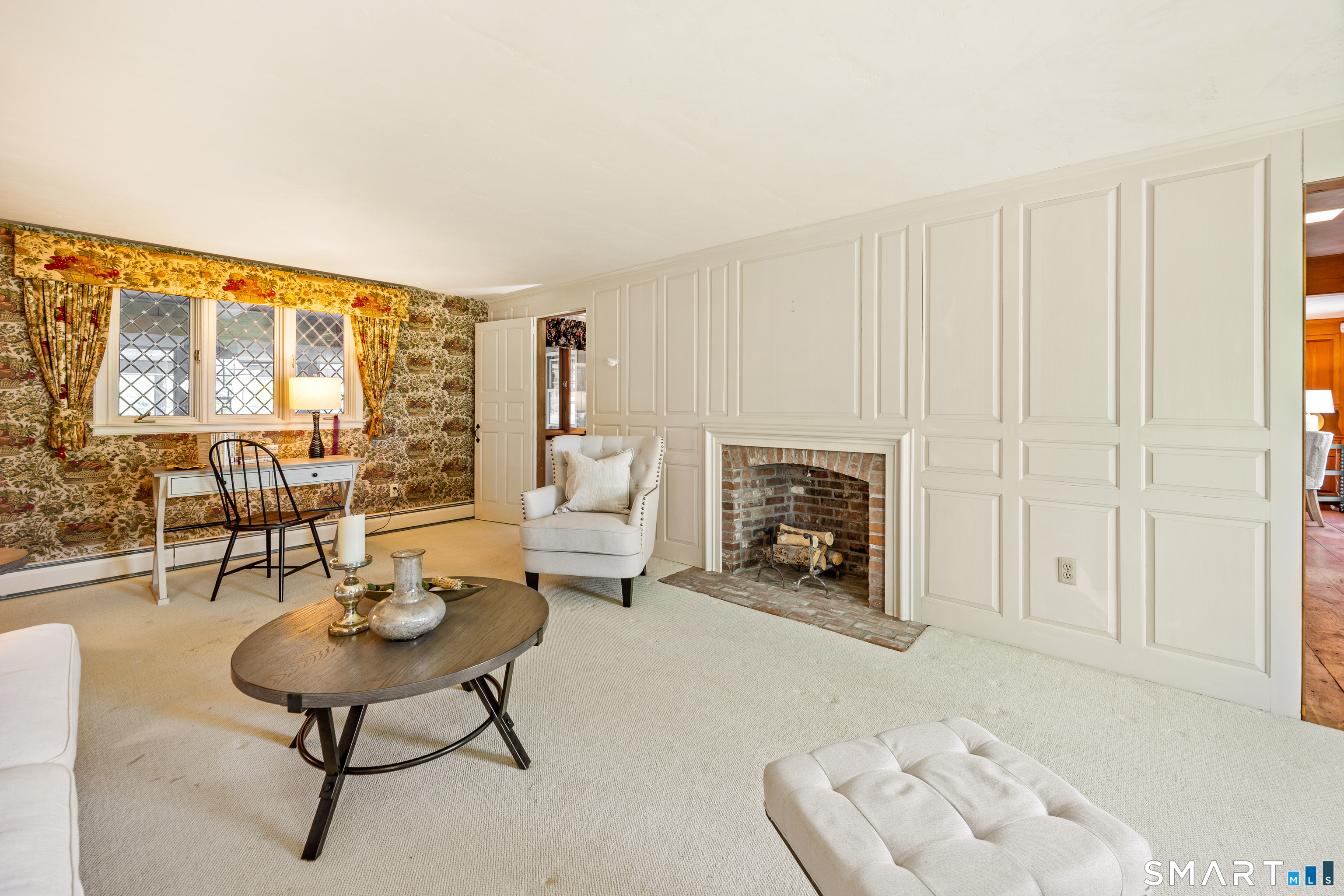 52 Susan Lane Meriden, CT 06450 - Photo 9 of 28 a living room with furniture and a fireplace