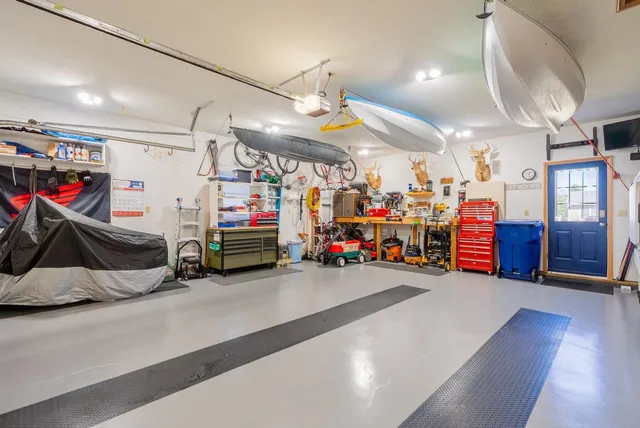 a view of house with garden space and swimming pool