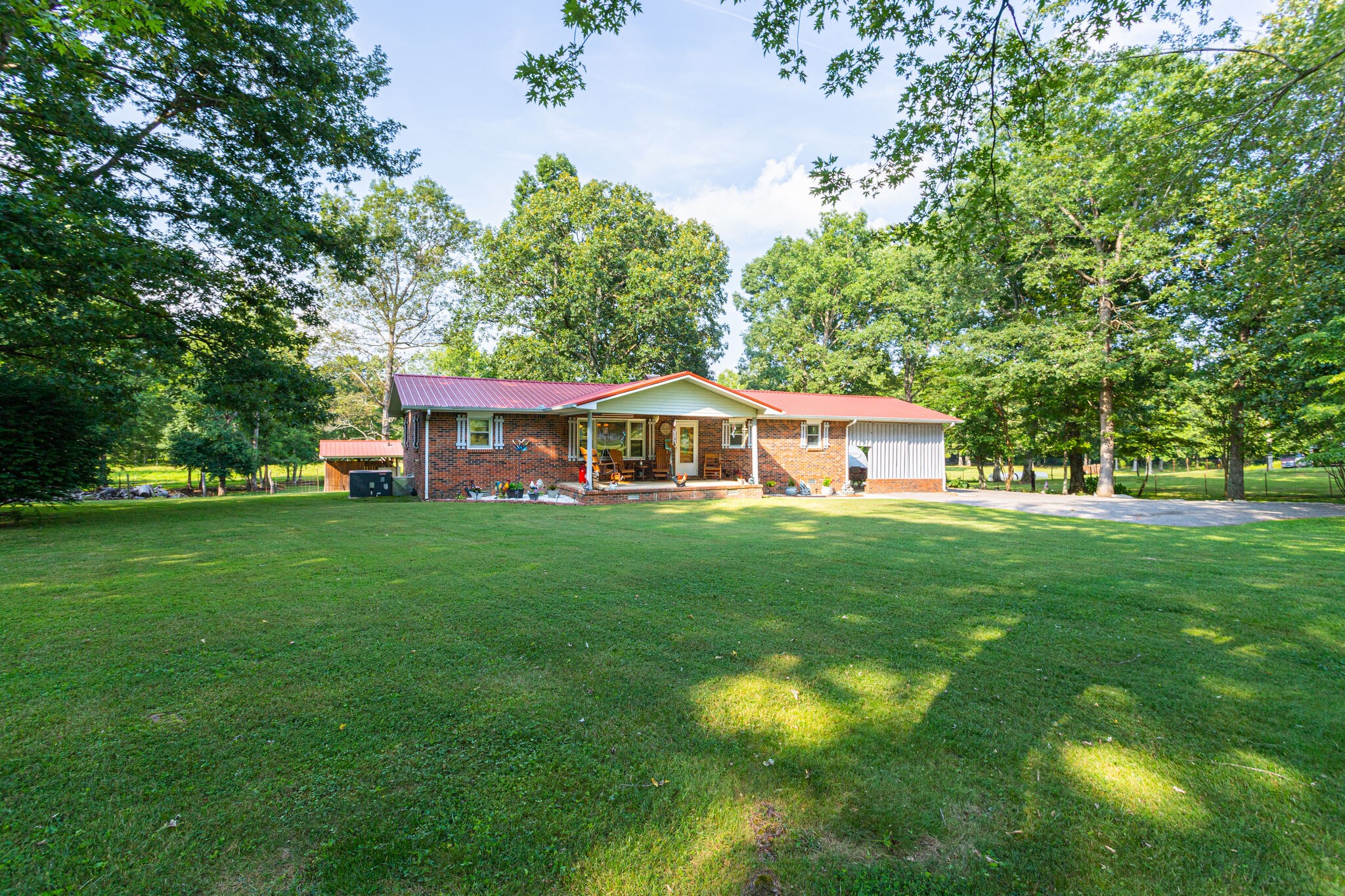 645 C Anderson Road Manchester, TN 37355 - Photo 1 of 47 a front view of a house with garden
