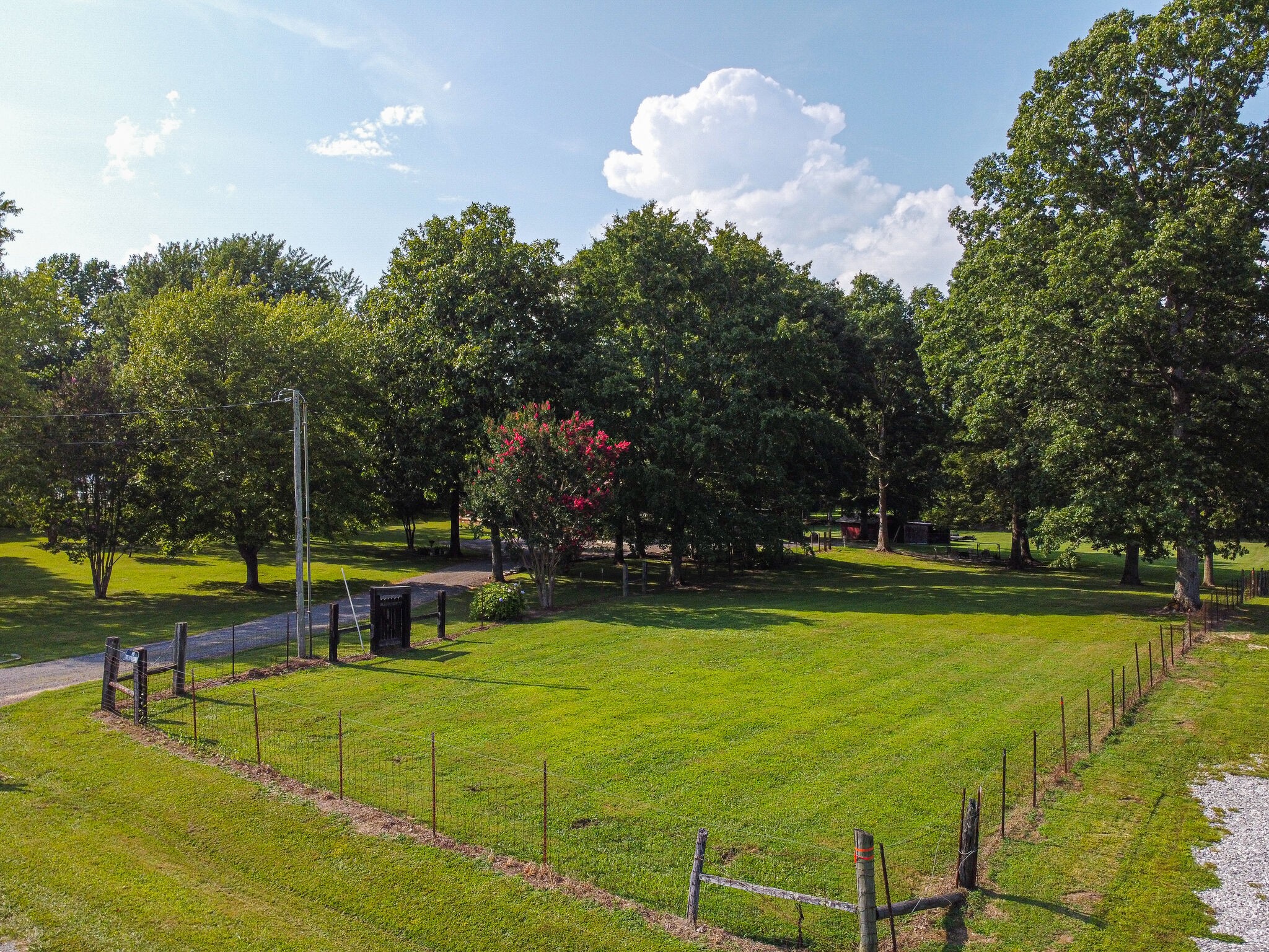 645 C Anderson Road Manchester, TN 37355 - Photo 40 of 47 a view of a swimming pool with a bench and trees