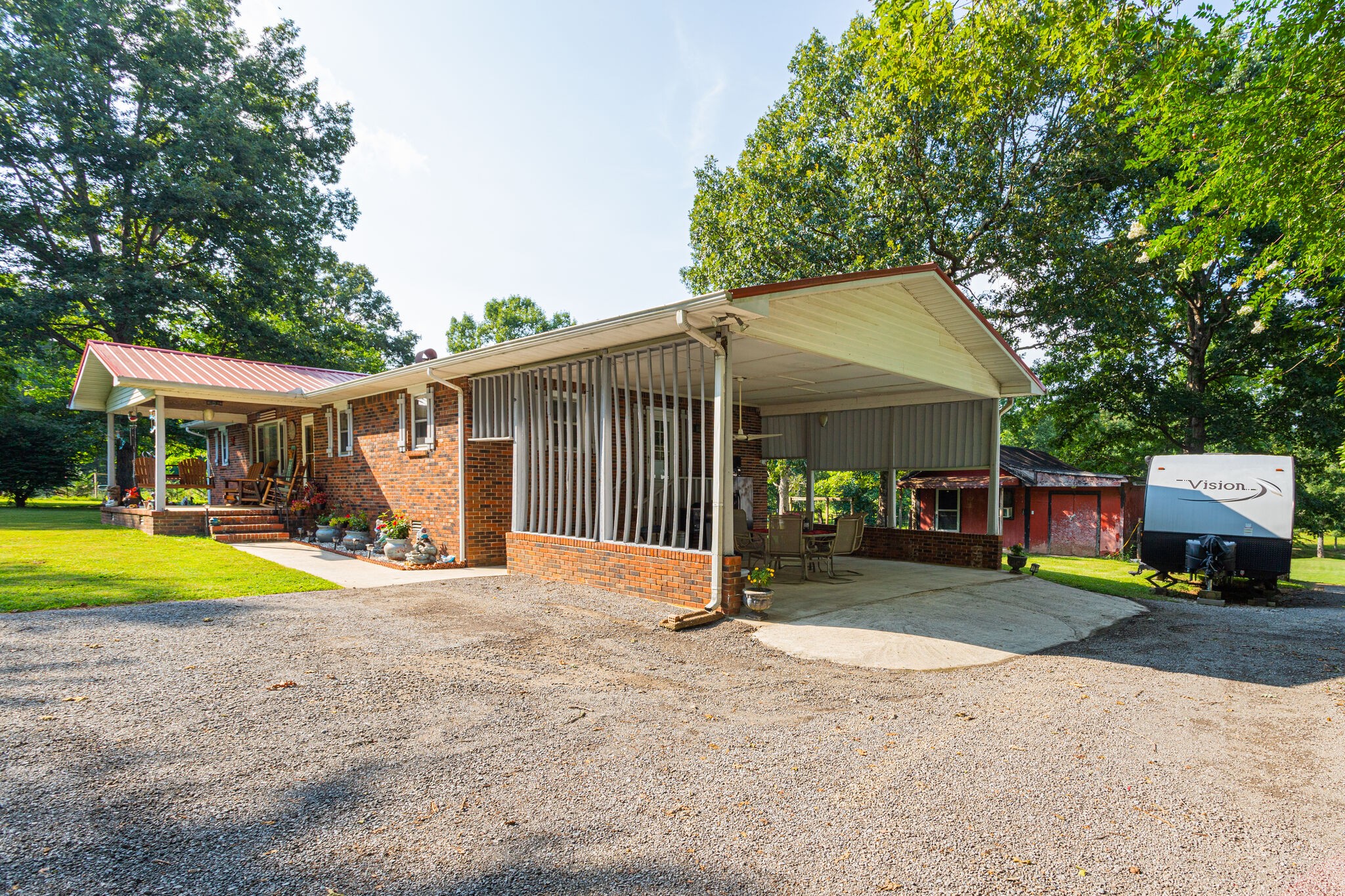 645 C Anderson Road Manchester, TN 37355 - Photo 8 of 47 a view of a house with a yard and sitting area