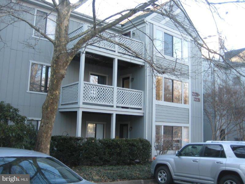 2226 Hunter's Run Drive, Unit 2226 Reston, VA 20191 - Photo 1 of 26 a front view of a house with parking space