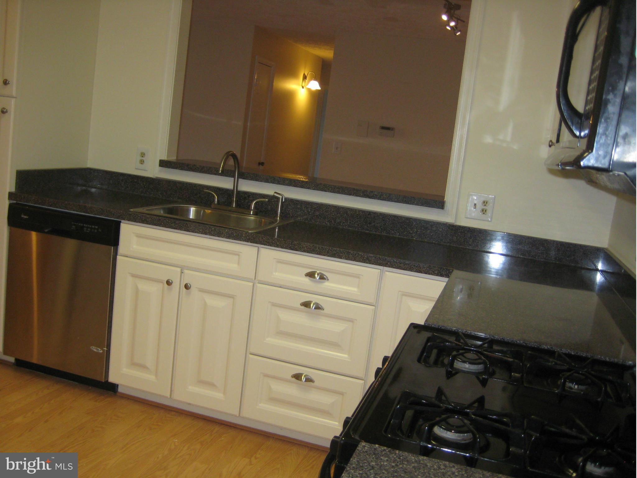 2226 Hunter's Run Drive, Unit 2226 Reston, VA 20191 - Photo 12 of 26 a bathroom with a sink and a mirror