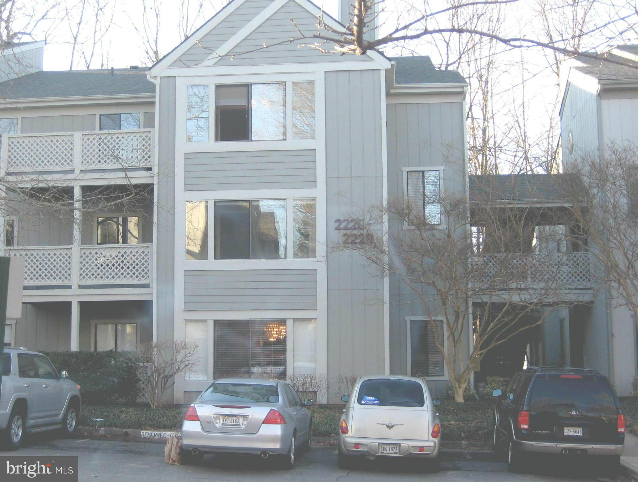 2226 Hunter's Run Drive, Unit 2226 Reston, VA 20191 - Photo 26 of 26 a car parked in front of a house