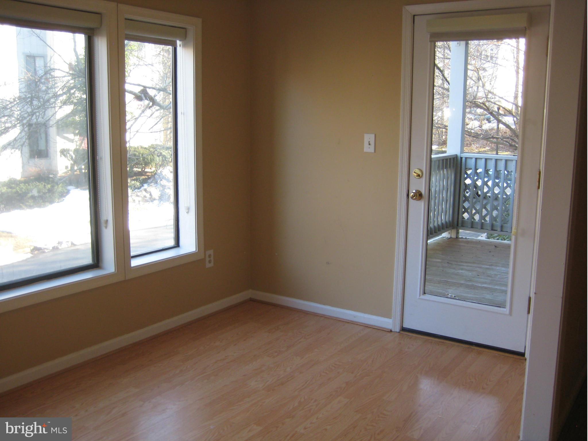 2226 Hunter's Run Drive, Unit 2226 Reston, VA 20191 - Photo 6 of 26 an empty room with windows