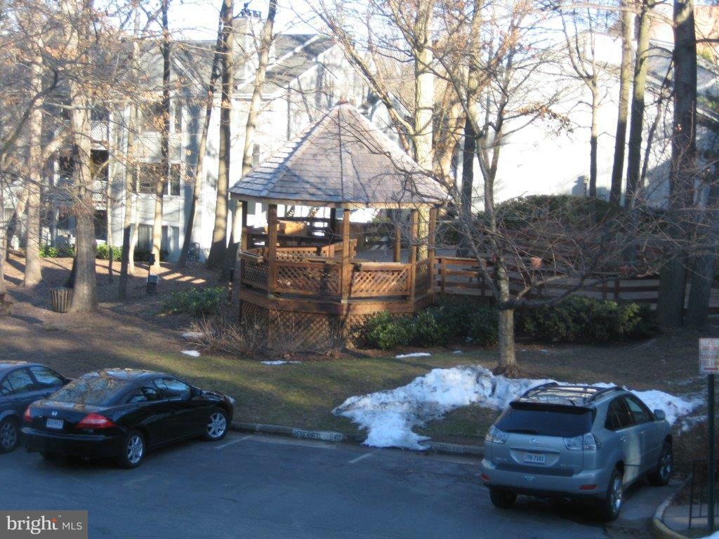 2226 Hunter's Run Drive, Unit 2226 Reston, VA 20191 - Photo 8 of 26 a car parked in front of a house