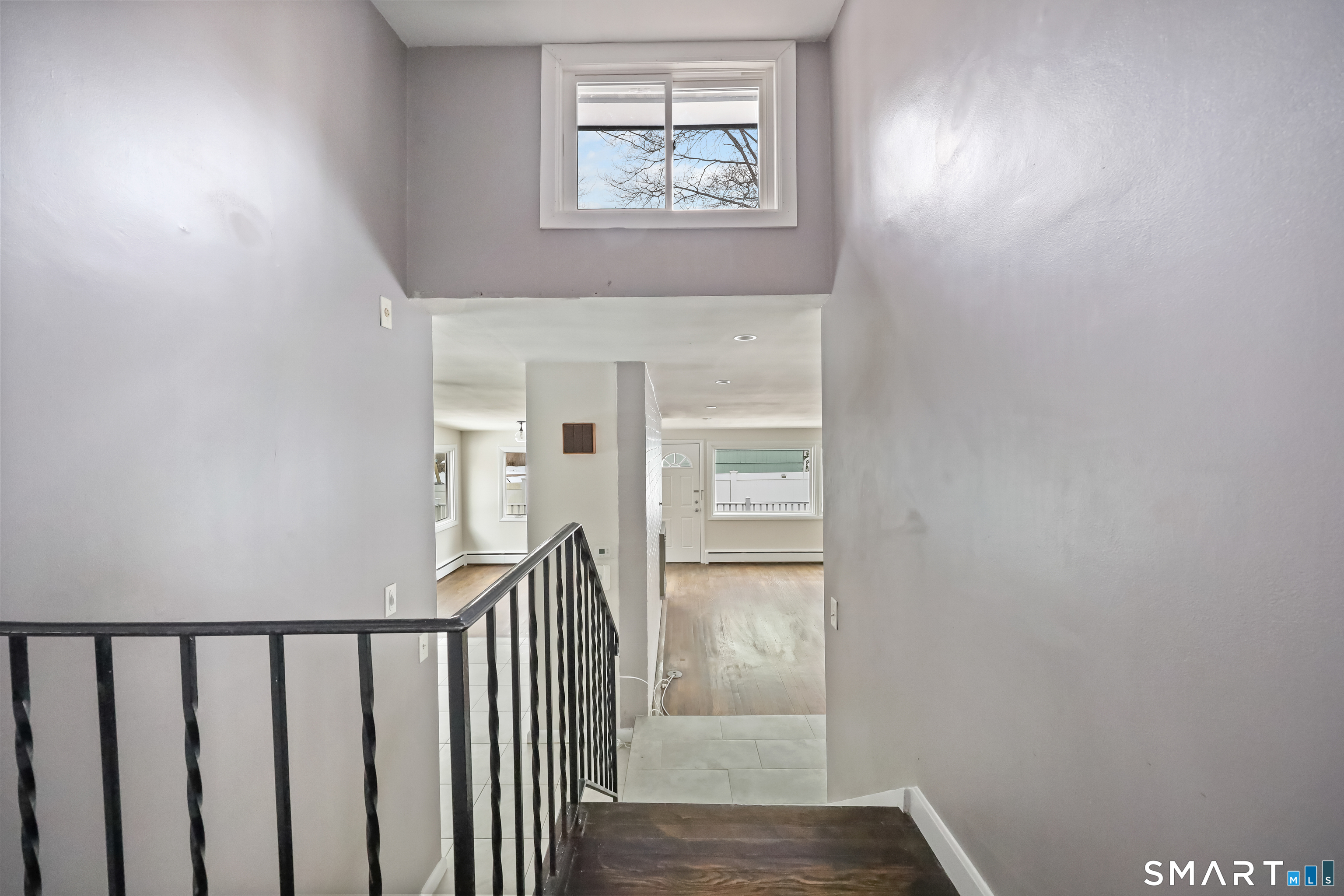 110 Corbin Road Hamden, CT 06517 - Photo 11 of 29 a view of hallway with wooden floor and a window