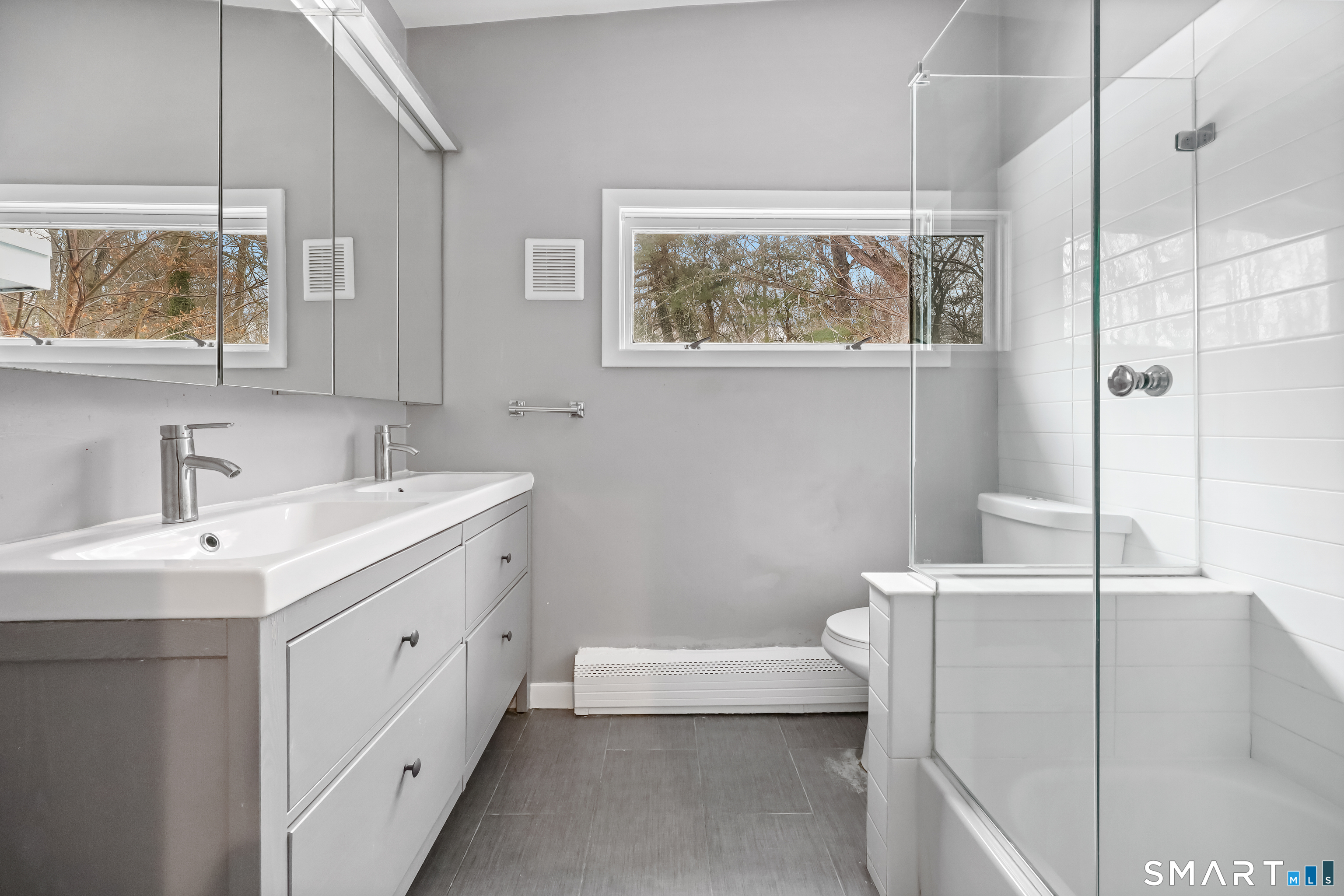 110 Corbin Road Hamden, CT 06517 - Photo 12 of 29 a bathroom with a tub sink and mirror