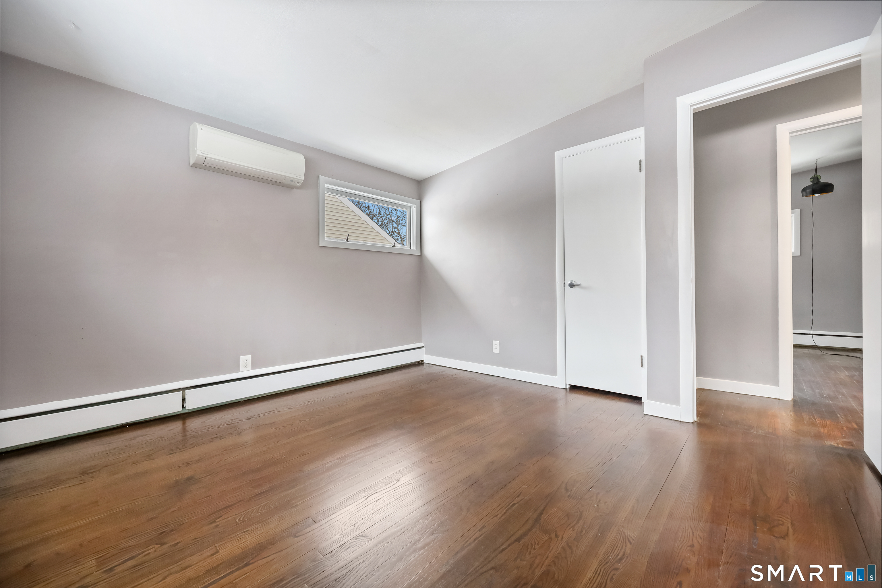 110 Corbin Road Hamden, CT 06517 - Photo 23 of 29 a view of an empty room with wooden floor