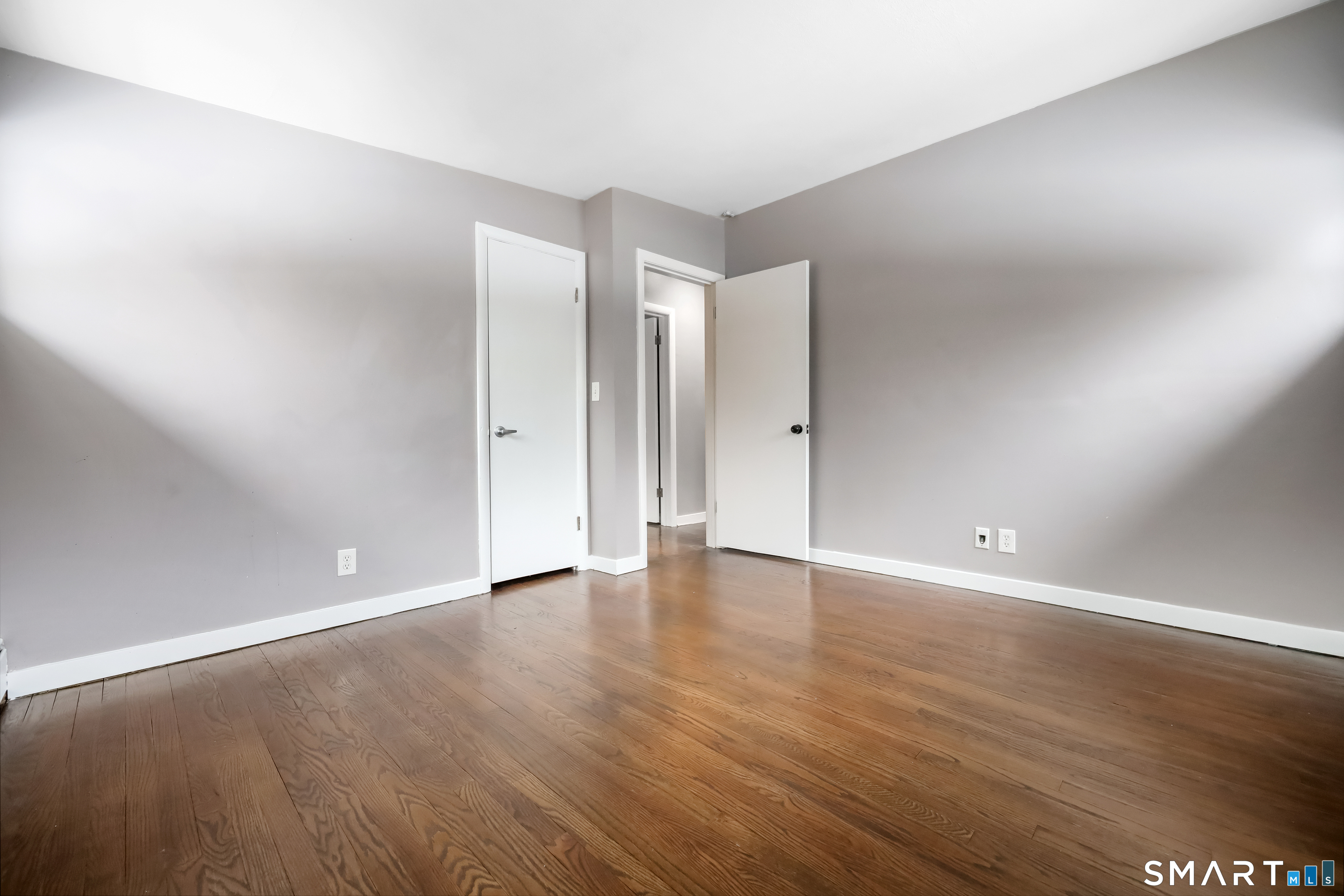 110 Corbin Road Hamden, CT 06517 - Photo 24 of 29 a view of an empty room with wooden floor