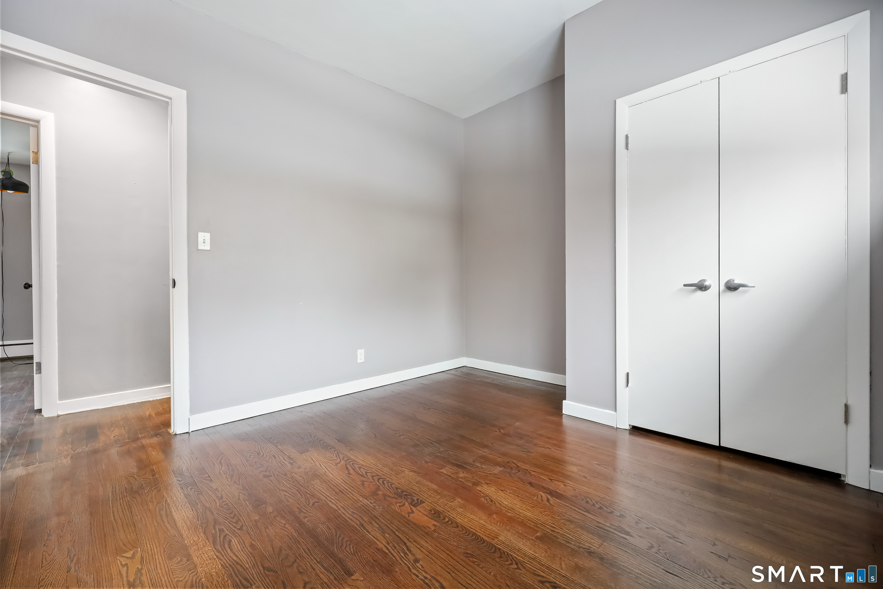 110 Corbin Road Hamden, CT 06517 - Photo 26 of 29 an empty room with wooden floor & closet area