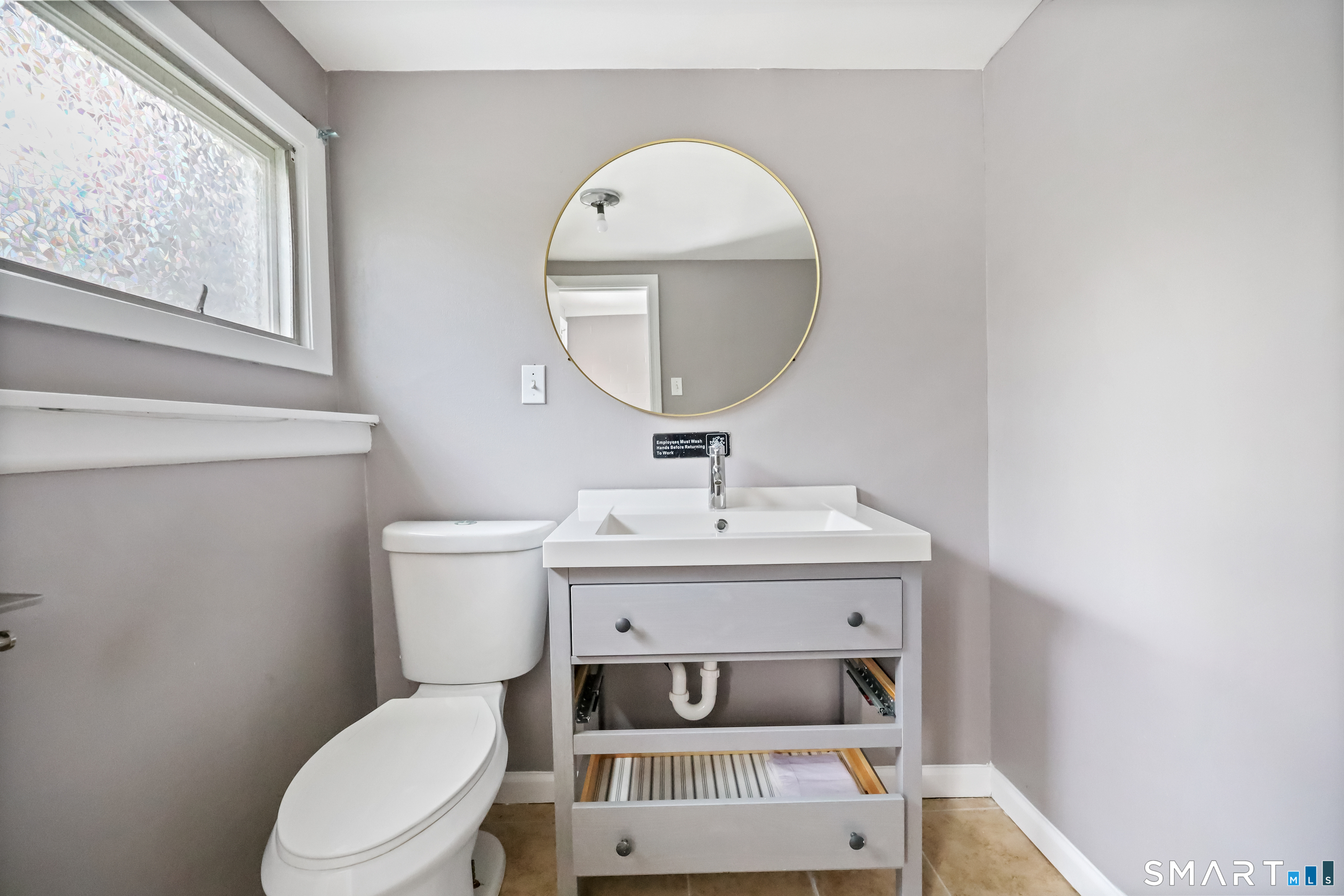 110 Corbin Road Hamden, CT 06517 - Photo 5 of 29 a bathroom with a sink toilet and mirror