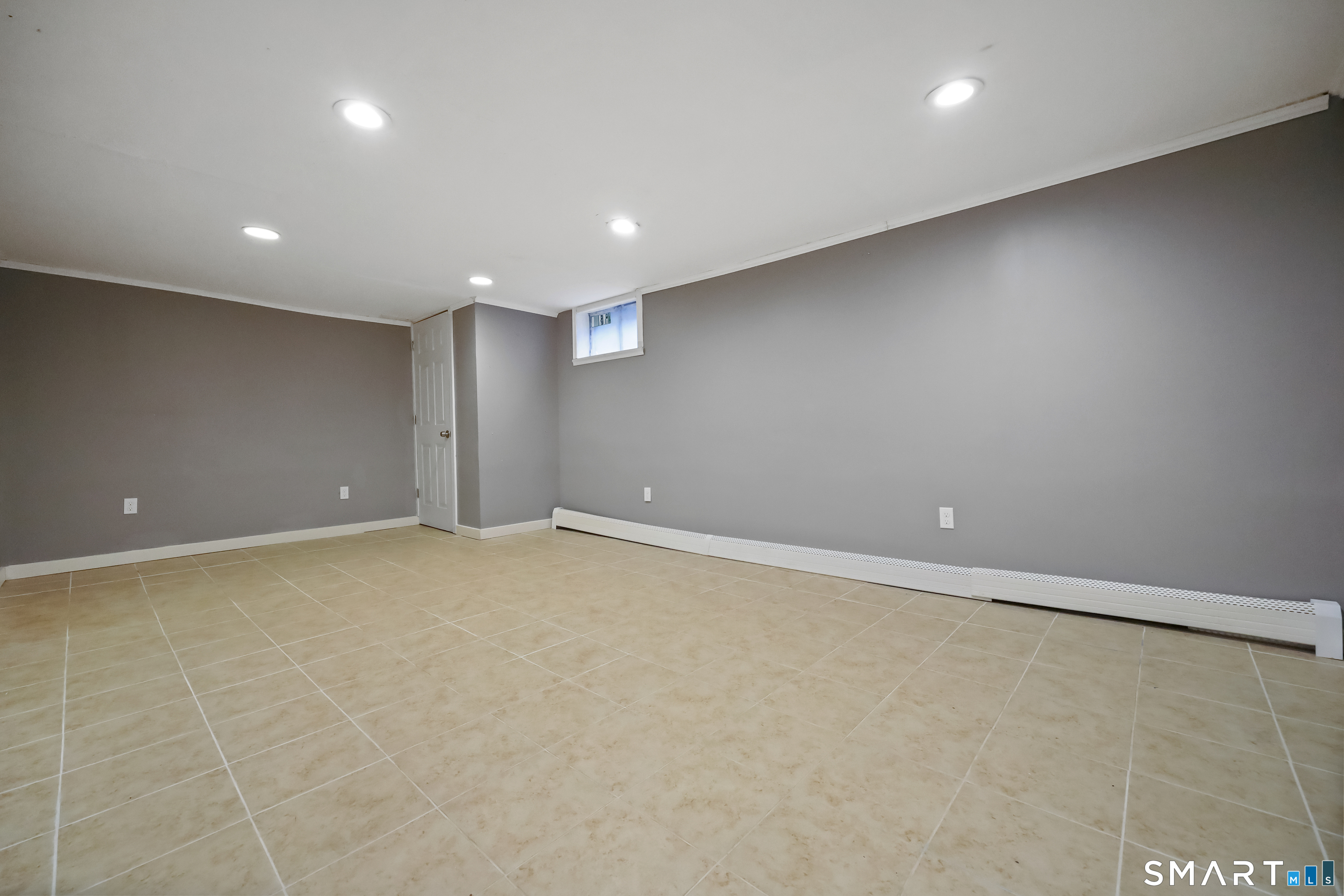 110 Corbin Road Hamden, CT 06517 - Photo 9 of 29 an empty room with a natural light