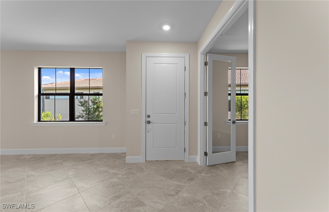 16784 Rolling Rock Boulevard Alva, FL 33920 - Photo 12 of 29 an empty room with windows and closet