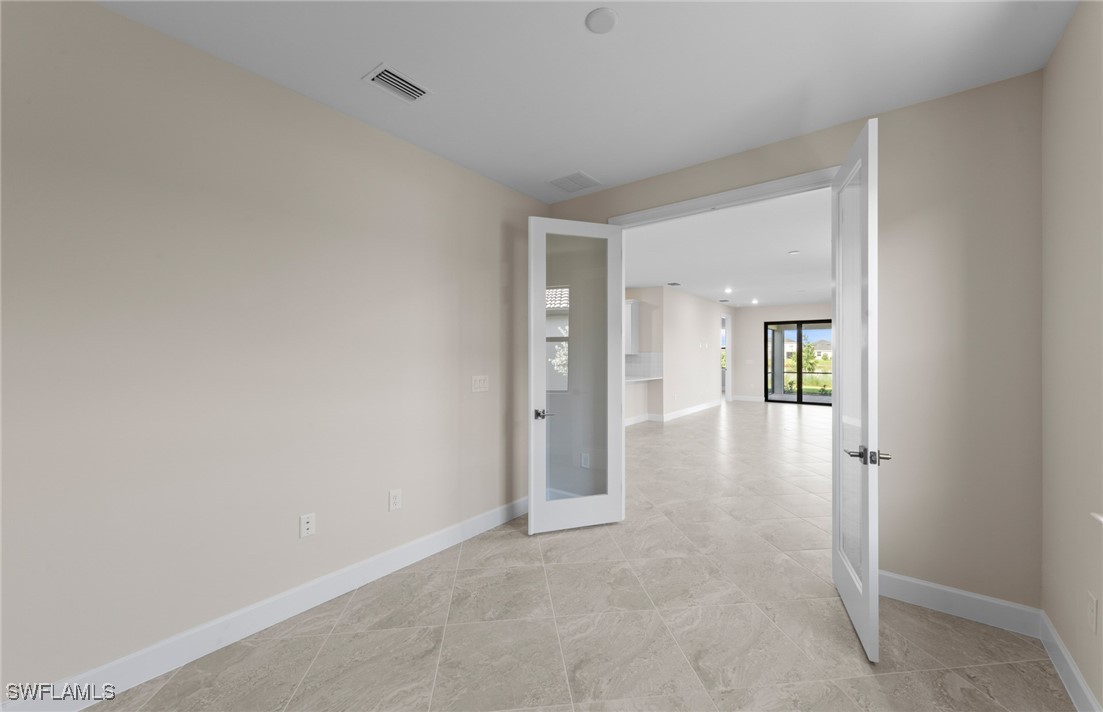 16784 Rolling Rock Boulevard Alva, FL 33920 - Photo 13 of 29 wooden floor in a hall with an entryway space