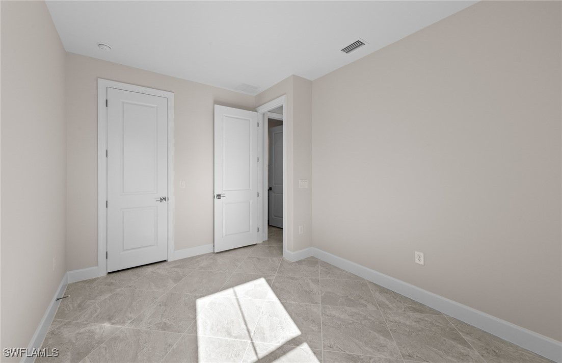 16784 Rolling Rock Boulevard Alva, FL 33920 - Photo 16 of 29 a view of an empty room