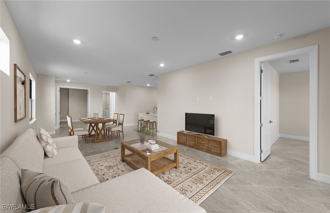 16784 Rolling Rock Boulevard Alva, FL 33920 - Photo 3 of 29 a living room with furniture and a flat screen tv