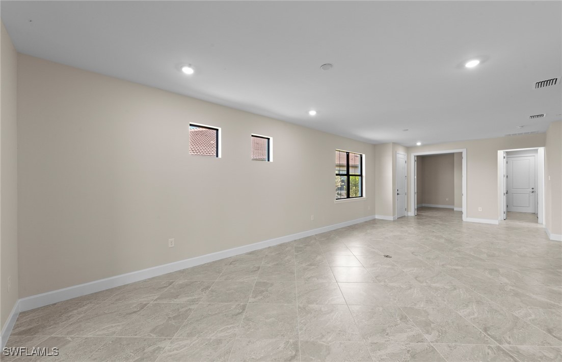 16784 Rolling Rock Boulevard Alva, FL 33920 - Photo 8 of 29 an empty room with windows