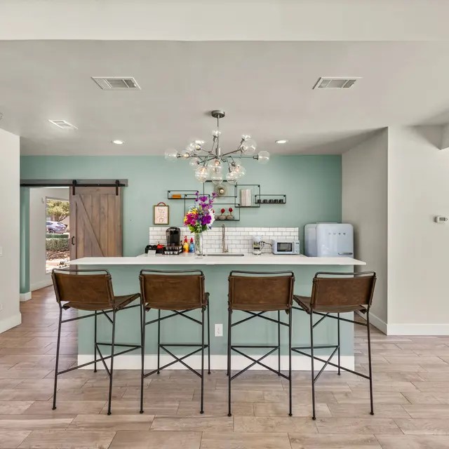 13005 Heinemann Drive, Unit 5501 Austin, TX 78727 - Photo 7 of 17 a view of a dining room with furniture and wooden floor
