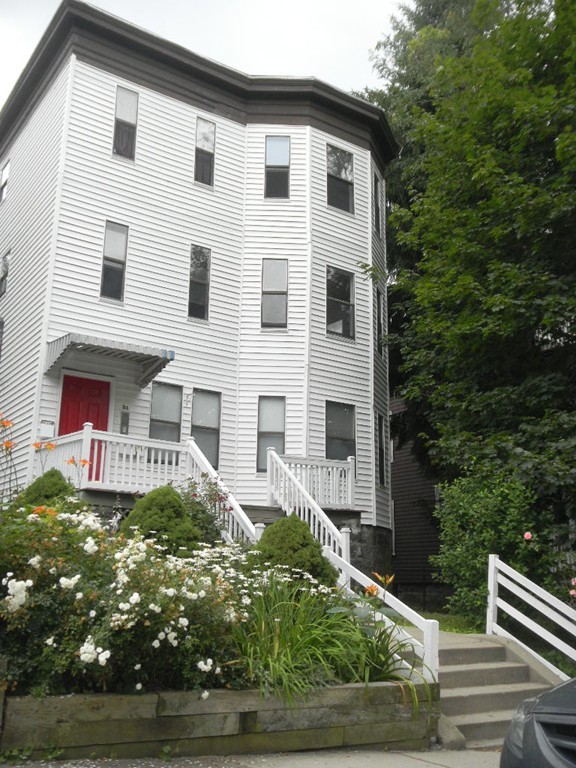 31 Iffley Road Boston, MA 02130 - Photo 1 of 21 a front view of a house with garden