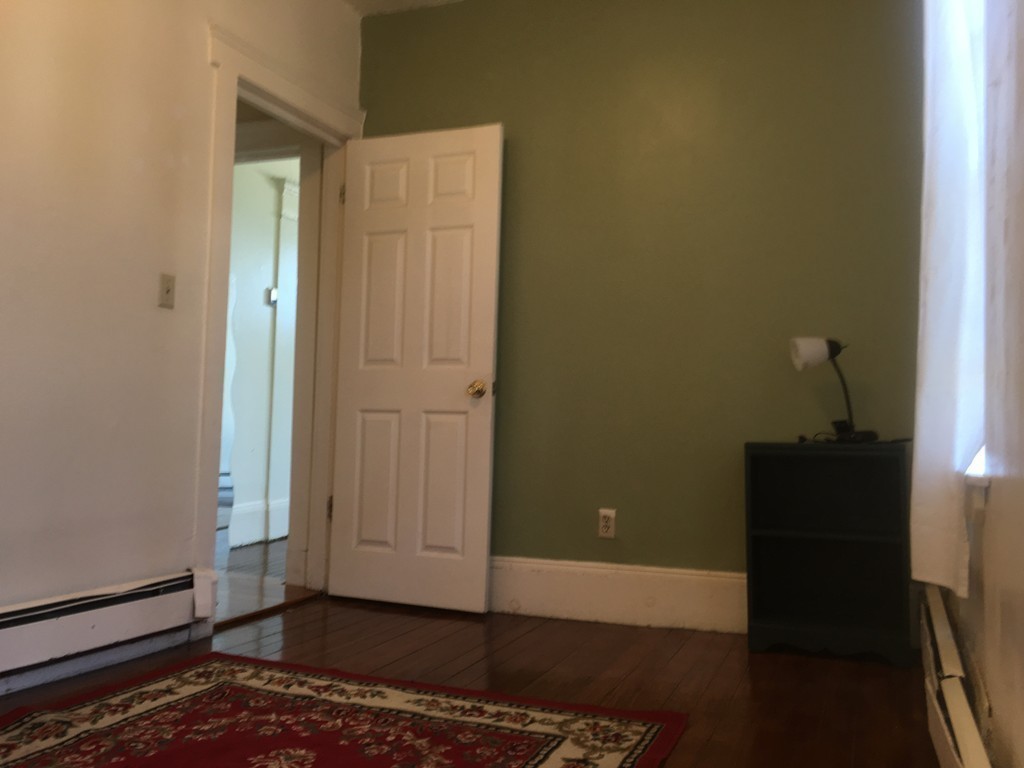 31 Iffley Road Boston, MA 02130 - Photo 13 of 21 a view of a livingroom with a bench
