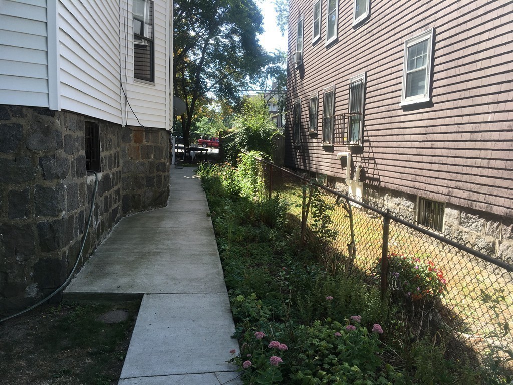 31 Iffley Road Boston, MA 02130 - Photo 18 of 21 a view of a pathway of a house with backyard