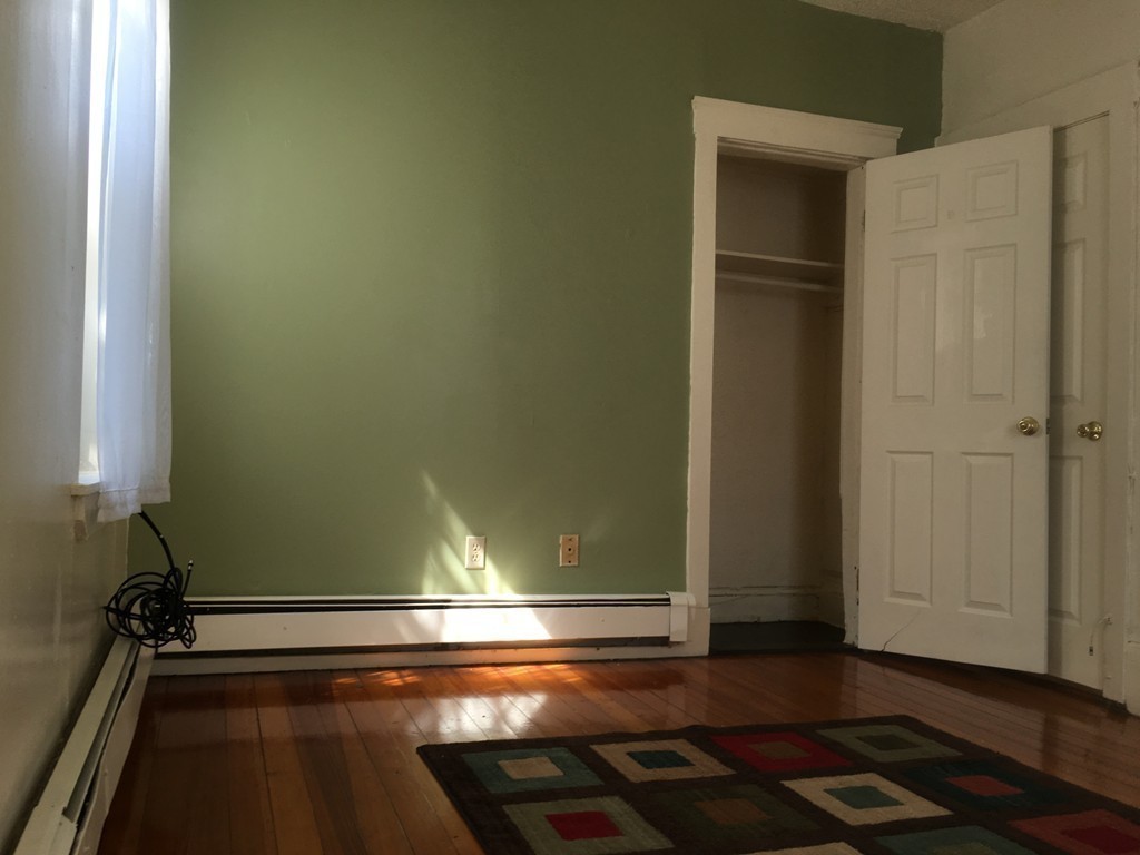 31 Iffley Road Boston, MA 02130 - Photo 6 of 21 a view of a room with wooden floor and cabinets