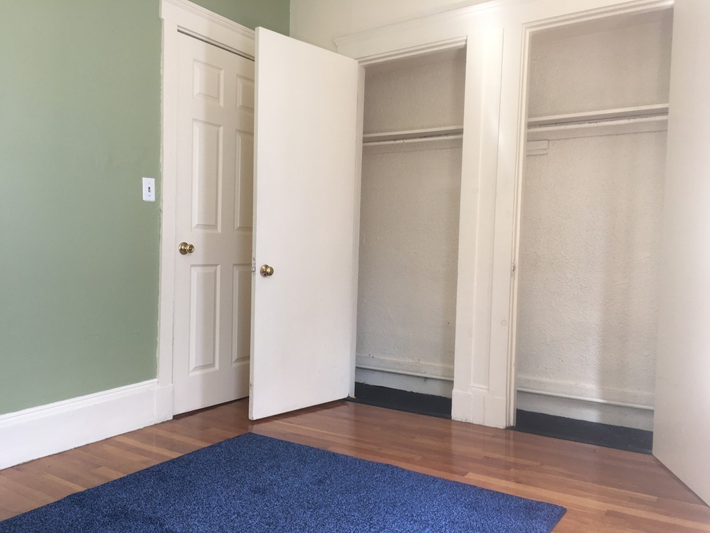31 Iffley Road Boston, MA 02130 - Photo 10 of 21 a view of an empty room with wooden floor