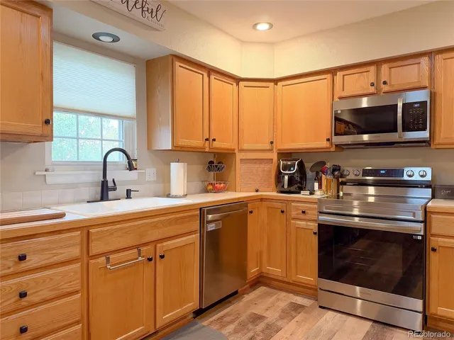 a bed room with a bed and a chandelier