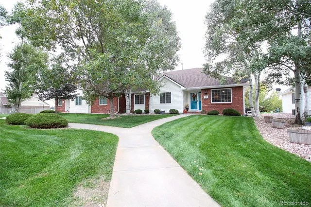 a dining room with furniture window and wooden floor